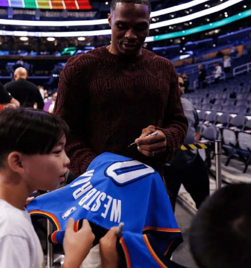 Westbrook posted a photo of himself signing autographs for a young fan on social media with the caption: Only love!