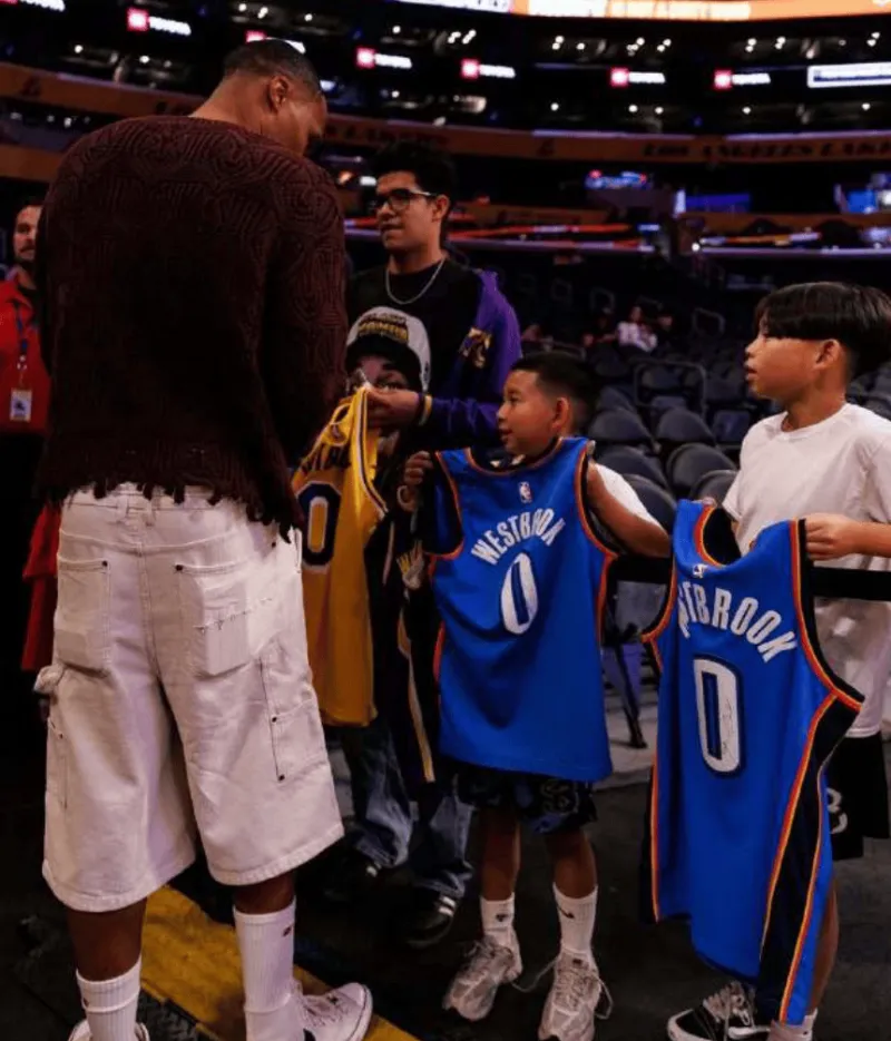 Westbrook posted a photo of himself signing autographs for a young fan on social media with the caption: Only love!