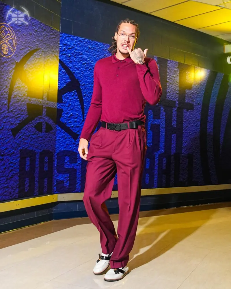 The Nuggets players entered their home arena, with Jokic standing out in a suit.