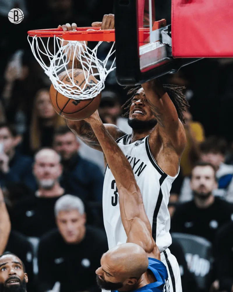 Powerful dunk! Brooklyn Nets' official media outlet shares photos of Claxton dunking on Gobert on the court.