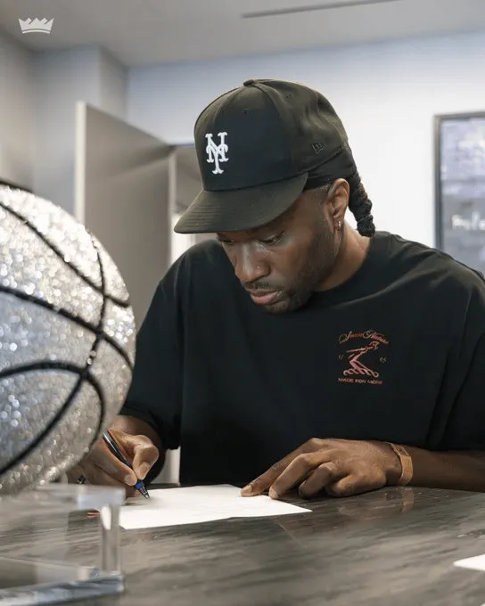 The King posted a photo of Achiuwa signing the contract with the caption: Officially signed.