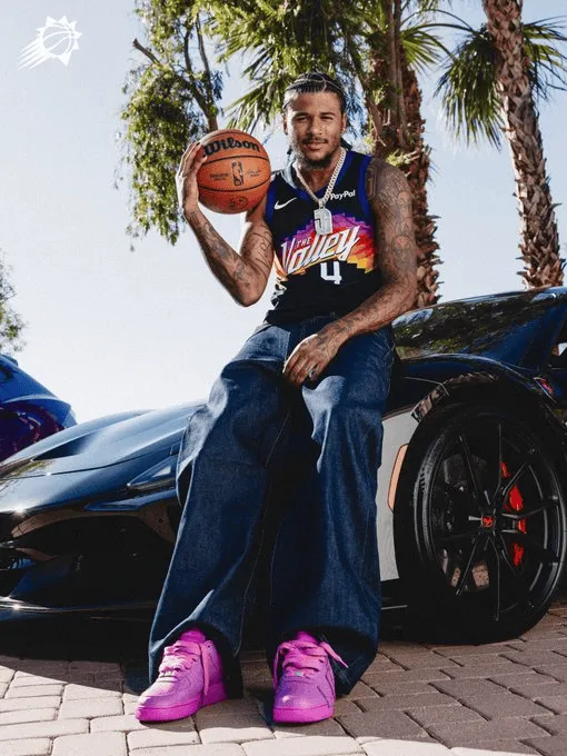 The sun shines on a photo of Jalen Green wearing a city edition jersey.