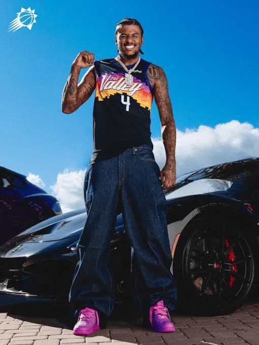 The sun shines on a photo of Jalen Green wearing a city edition jersey.