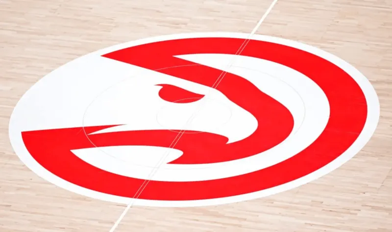 A former Hawks vice president is accused of embezzling $3.8 million to buy gifts for his girlfriend and a Porsche.