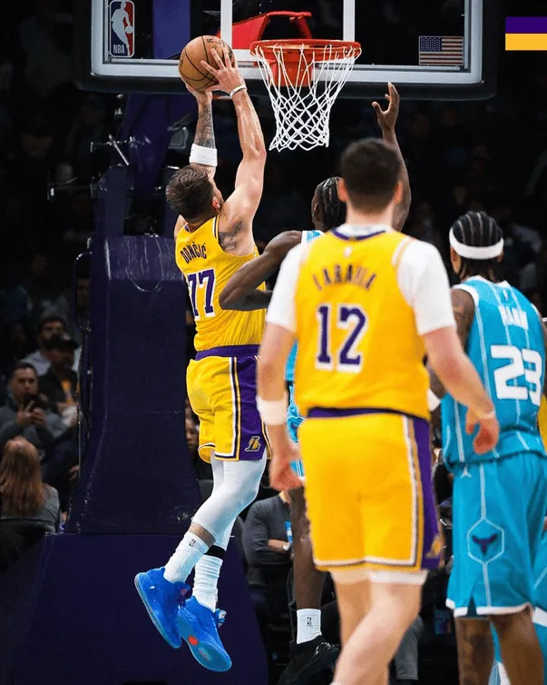 Luka Doncic slams a two-handed dunk in the paint