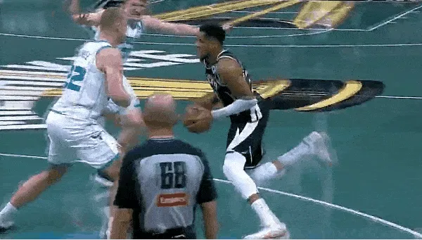 Giannis Antetokounmpo knocked down Plumlee, jumped up and dunked for a 2+1 play.