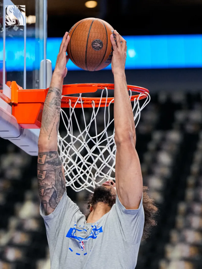 Welcome back! Mavericks' social media posts show Lifeley warming up before the game.